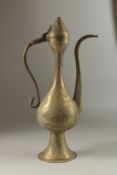 A FINELY ENGRAVED LARGE 19TH CENTURY SYRIAN DAMSCUS BRASS EWER, 46cm high.