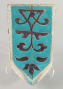 A RARE 14TH CENTURY PERSIAN OR CENTRAL ASIAN TIMURID GLAZED POTTERY MUKARNAS TILE, with turquoise