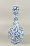 A CHINESE BLUE AND WHITE PORCELAIN GARLIC HEAD LOTUS VASE, further decorated with panels of floral