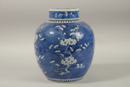 A LARGE CHINESE BLUE AND WHITE PORCELAIN GINGER JAR AND COVER, painted with prunus blossom, the base