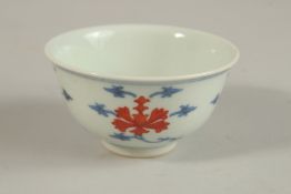 A SMALL CHINESE BLUE AND WHITE PORCELAIN CUP, with character mark to base, 8cm diameter.