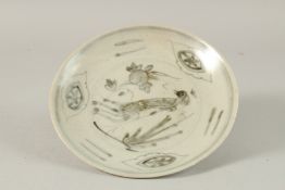 A CHINESE BLUE AND WHITE PORCELAIN SHIPWRECK CARGO PLATE, with peacock and peach design, 20.5cm