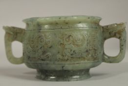 A FINE CHINESE CARVED JADE TWIN HANDLE CENSER, with dragon formed handles and carved archaic style