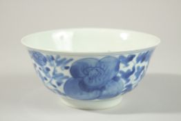 A CHINESE BLUE AND WHITE PORCELAIN BOWL, with flower head decoration to exterior, the base with