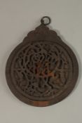 A LARGE ISLAMIC ENGRAVED METAL ASTROLABE, 32cm long.