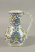 A TURKISH KUTAHYA POTTERY WATER JUG.