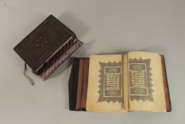 AN 18TH-19TH CENTURY OTTOMAN TURKISH LEATHER BOUND ILLUMINATED QURAN, encased within a fitted