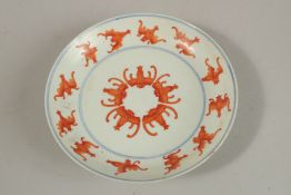A CHINESE BLUE AND WHITE WITH IRON RED PORCELAIN BAT DISH, with character mark to base, 15.5cm