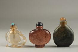 A COLLECTION OF THREE CHINESE SNUFF BOTTLES: a rabbit shaped rock crystal bottle with turquoise lid,