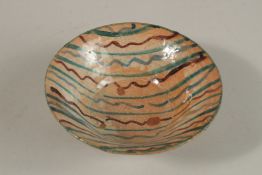 A FINE 17TH-18TH CENTURY PERSIAN GLAZED POTTERY BOWL, 15.5cm diameter.