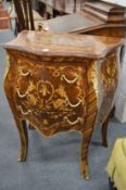 A French style marquetry inlaid bombe three drawer petit commode.
