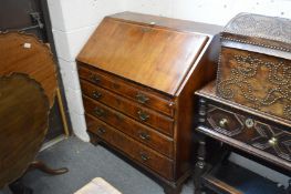 An 18th century walnut bureau.