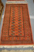 A modern Bokhara style rug, 157cm x 97cm.