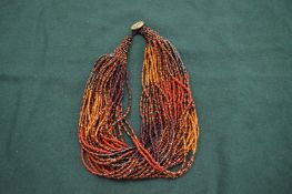 An Abacu necklace, signed.