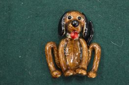 An amusing dog brooch.