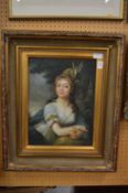 Bust length portrait of a young girl holding an apple, oiliographic print in a decorative gilt