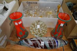 Colourful glass fish and other glassware.