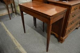 A 19th century mahogany rectangular fold-over card table.