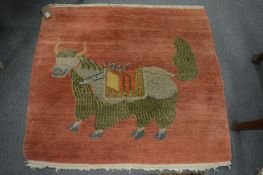 An unusual small woollen rug depicting a bull, 92cm x 96cm.