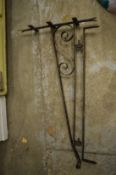 A wrought iron sign bracket.