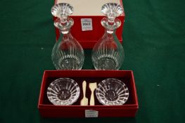 A pair of Baccarat small cut glass bottles, boxed with a pair of similar dishes and spoons