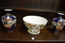 A Wedgwood 'Surrey' pedestal bowl and a pair of vases.