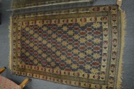 A small Persian design rug, 147cm x 89cm.