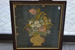 Silk work picture of flowers in a basket.