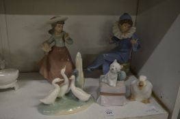 Five Lladro and Nao figures.