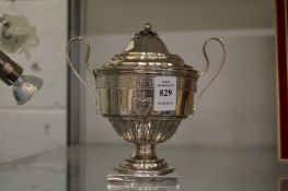 A silver twin handled pedestal cup and cover.