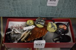 A group of fourteen pendants and brooches.