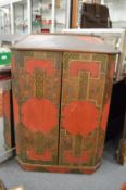 An unusual chinoiserie and lacquer decorated hanging corner cupboard.