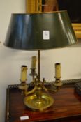 A good gilt brass three branch table lamp with toleware shade.