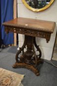 A good Anglo Indian padouk wood pedestal table with profusely carved decoration.