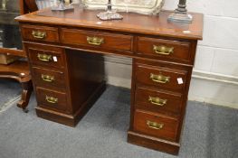 A Victorian walnut twin pedestal desk.