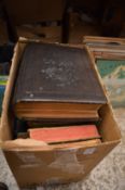 A box of books to include two bibles.