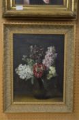 Still life of flowers in a vase, oil on canvas in a decorative gilt frame.