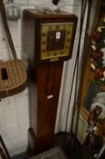 A 1930's walnut cased grandmother clock.