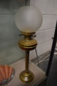 A brass oil lamp.