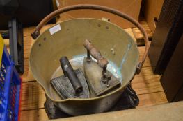 Preserve pan, two old irons, wooden stand etc.