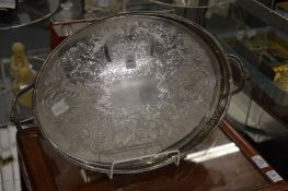 A plated twin handled tray.