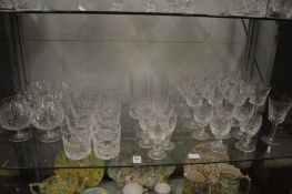 A collection of Waterford Lismore glassware comprising twelve 15cm wine glasses, a single 14cm