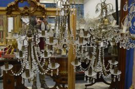 A set of three five branch glass and metal chandeliers.