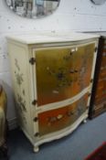 A Chinese style gilt lacquer and painted serpentine fronted four door cabinet.