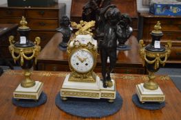 A good French marble bronze and ormolu clock garniture, the clock mounted with a cherub, complete