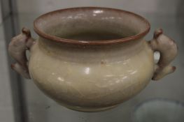 A Chinese crackle glazed twin handled censer.