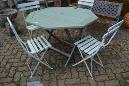 Four folding garden chairs.