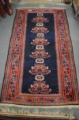 A small Persian rug, 175cm x 100cm.