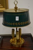 A good gilt brass three light table lamp with toleware shade.