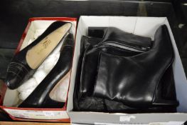 A pair of ladies black leather shoes and a pair of black leather boots.